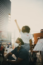 man in white t-shirt and black pants wearing white goggles