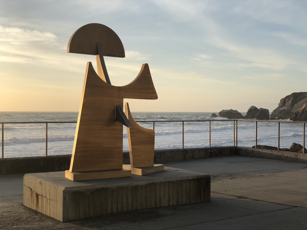 brown wooden stand on gray concrete dock during daytime