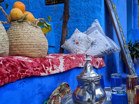 clear glass jar on blue textile