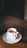 A warm cup of steaming Penang white coffee nestled in a cozy kitchen setting.
