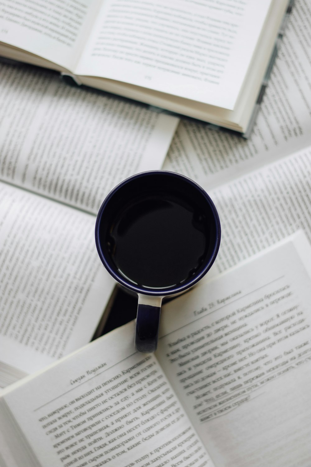 black ceramic mug on white paper