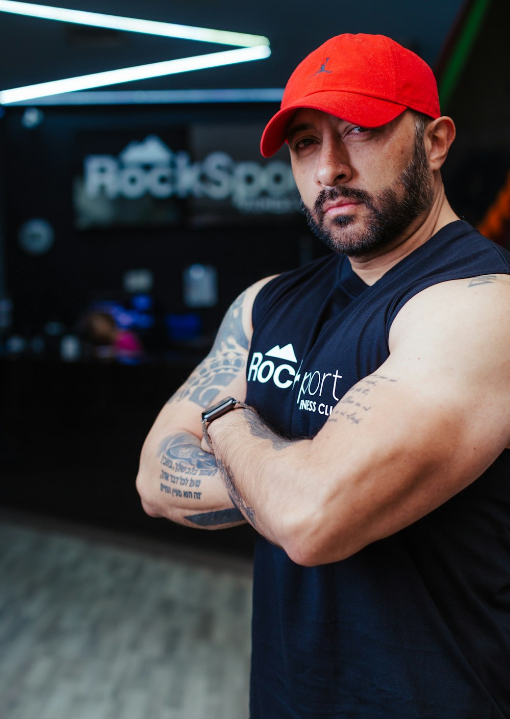 a man wearing a red hat and a black shirt