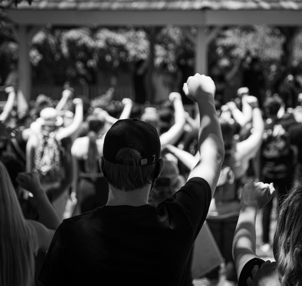 grayscale photo of people in a concert
