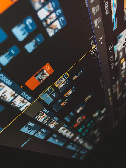 Close-up of a digital video editing timeline with colorful clips and transitions.