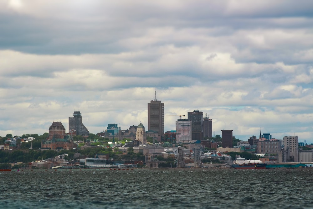 city skyline under cloudy sky during daytime