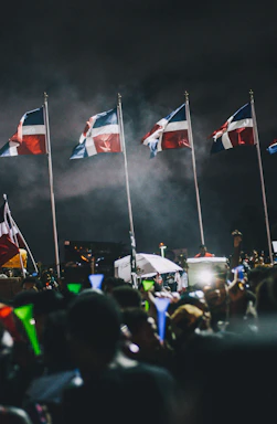 A warm community gathering under colorful banners celebrating independence day.