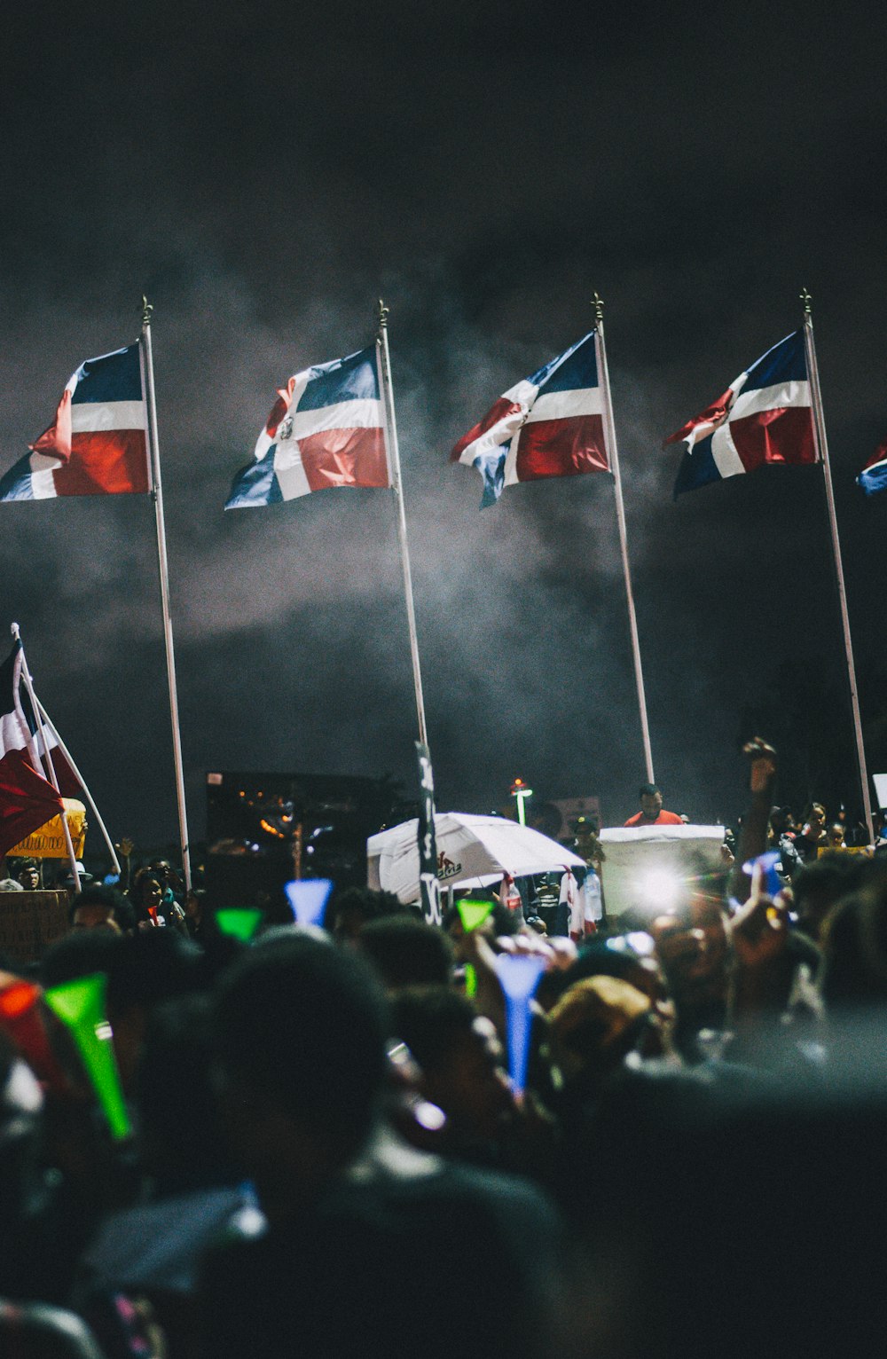 people holding flags during daytime