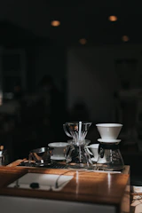 A neat display of coffee grinders, filters, and brewing equipment on a simple white background.