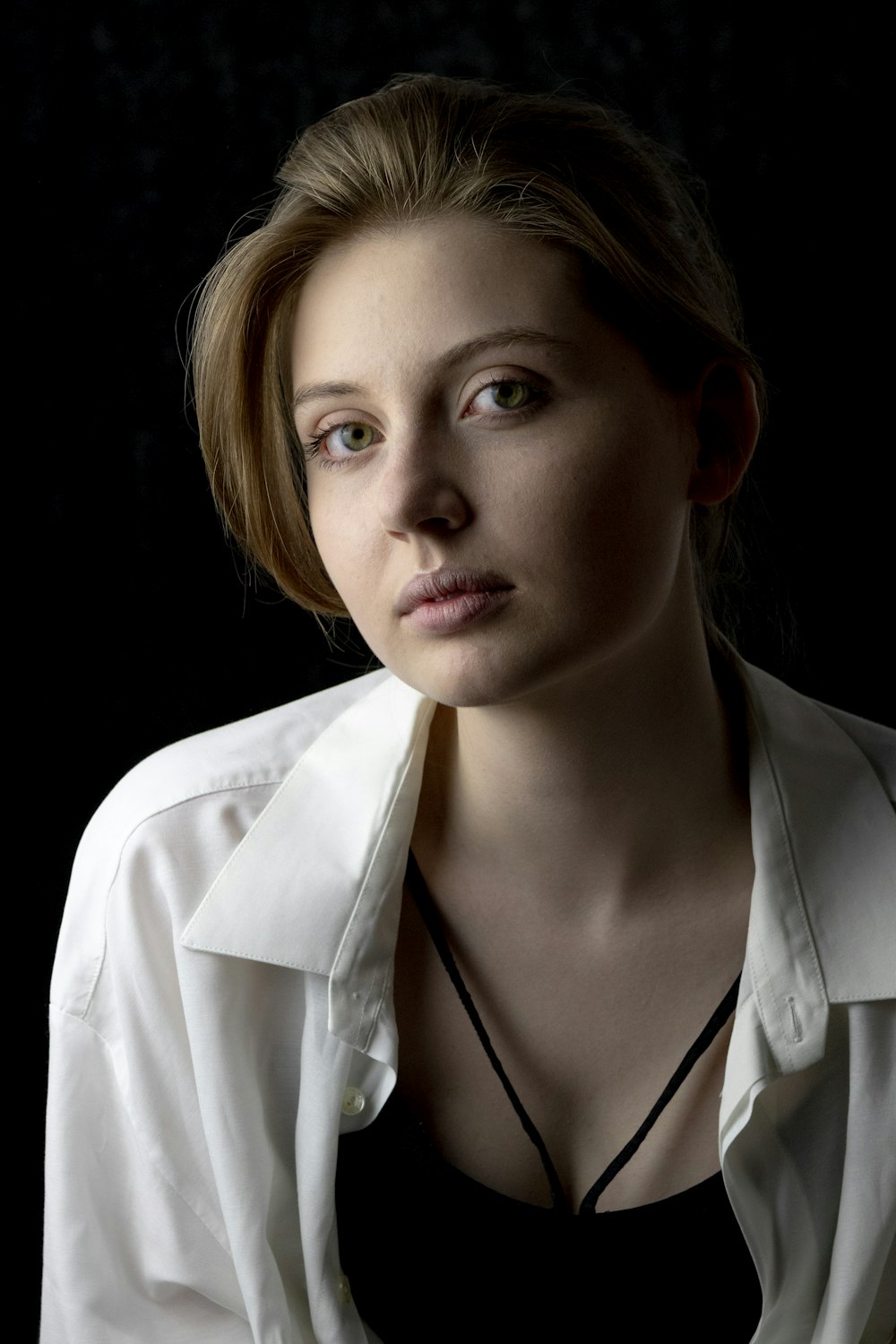 woman in white collared shirt