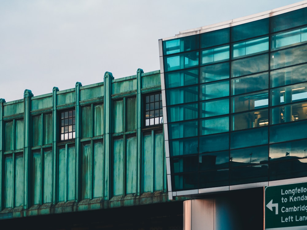 green and black building under blue sky during daytime