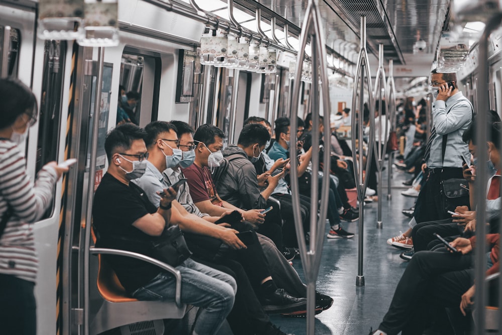 people sitting on black gang chair