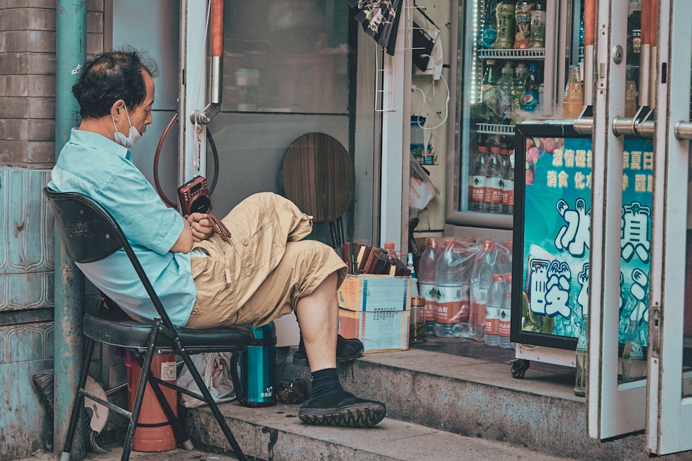 man in brown long sleeve shirt sitting on chair