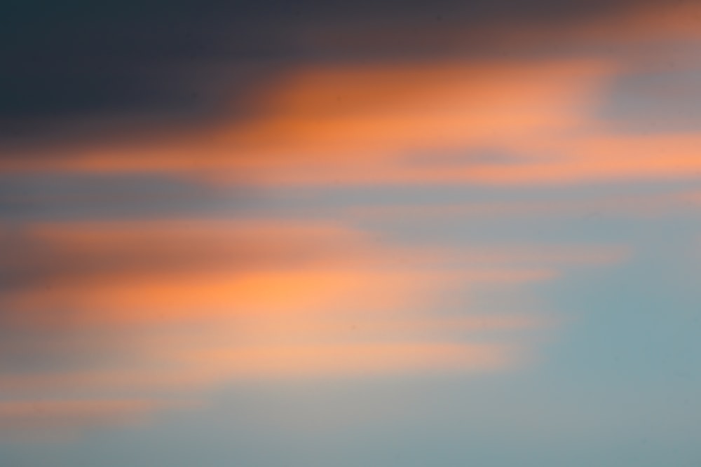 orange and grey clouds over the sea