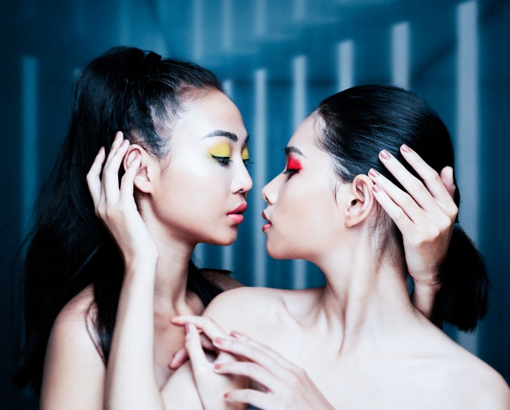 woman with red lipstick and black mascara