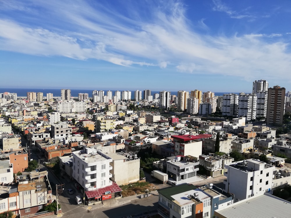 city buildings under blue sky during daytime