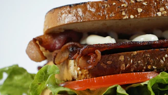 brown bread with green vegetable and bacon
