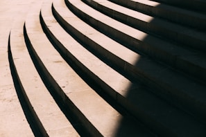 Close-up of a handcrafted stone step glowing warmly in the afternoon sun
