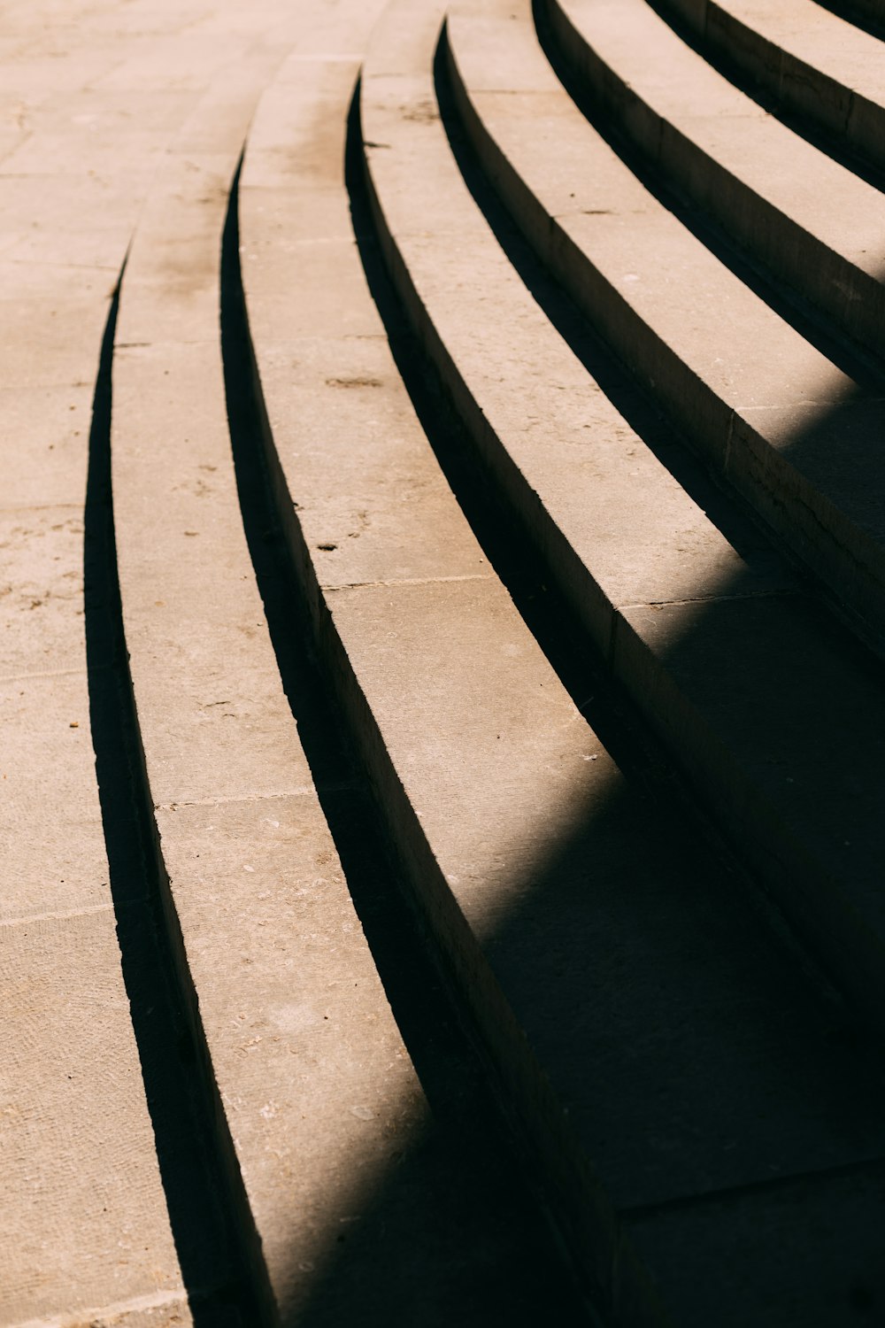 black metal fence on gray sand during daytime