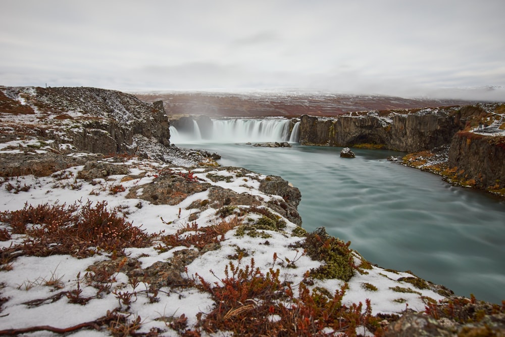 water falls under gray sky