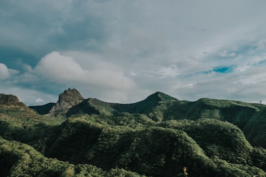 green mountain under white clouds during daytime in Kediri Indonesia