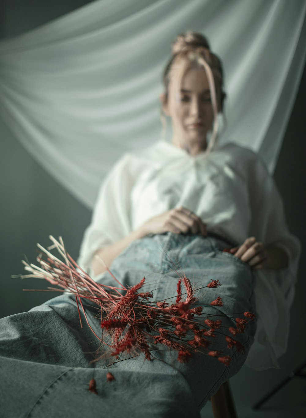 man in white thobe sitting on white textile