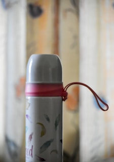 white and red plastic bottle