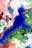 An abstract painting featuring a prominent blue silhouette resembling a human figure set against a dynamic and swirling background of vibrant colors. The backdrop showcases a combination of greens, reds, and whites, with intricate textures give a sense of movement and fluidity.