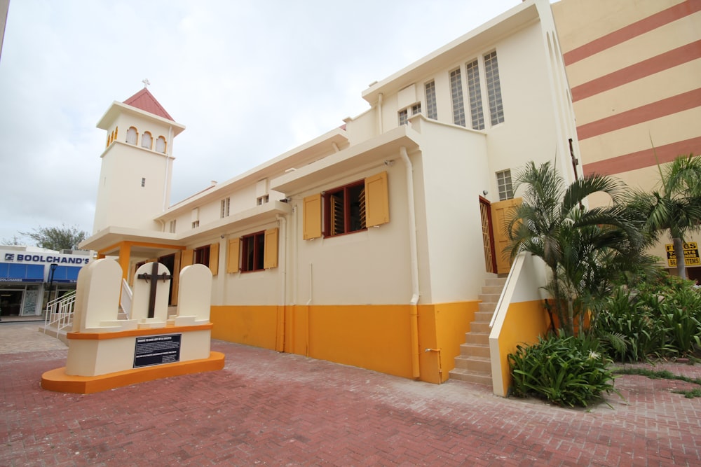 yellow and white concrete house