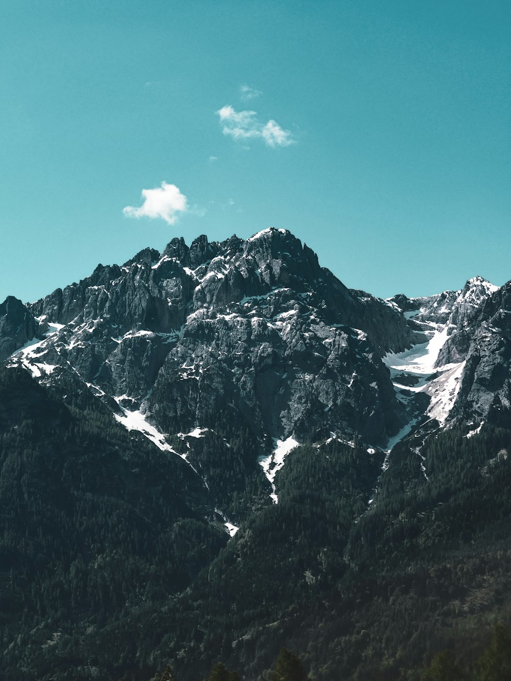 snow covered mountain under blue sky during daytime