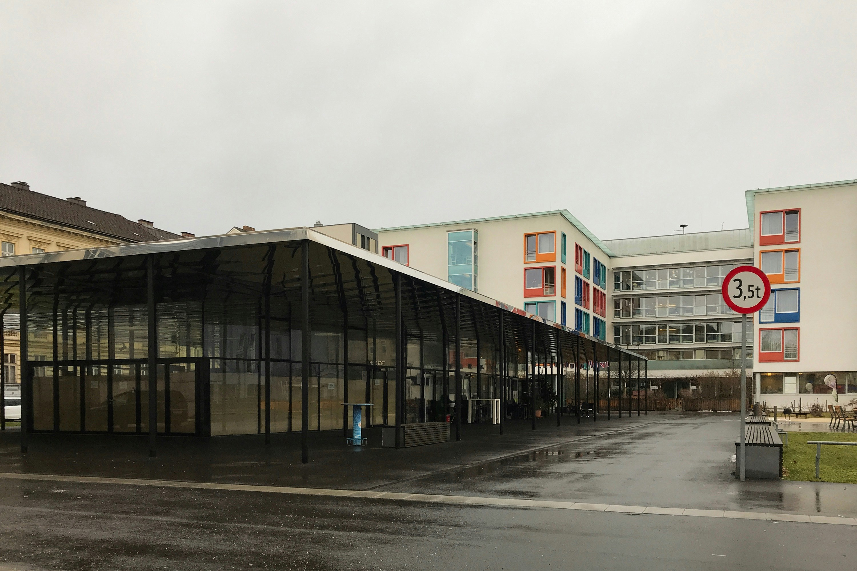 white and brown concrete building under white sky during daytime