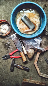 Close-up of water damage repair tools neatly arranged on a clean work surface.