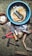 A collection of tools and miscellaneous items are spread out on a textured surface. There is a blue container filled with water and some cleaning cloths at the center. Around it, there are various tools including a pair of red-handled pliers, a hammer, an axe, a chisel, a stone, a partially opened plastic bag with an unidentified object, a small wooden handle tool, several circular metal rings, and a small container filled with nails.