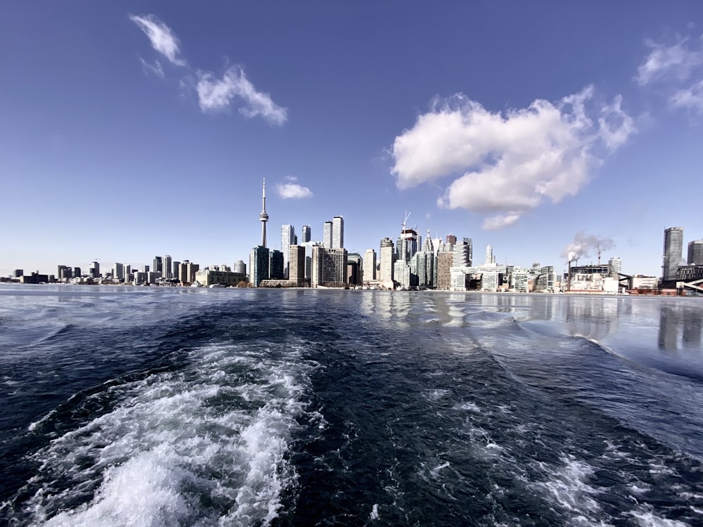 city skyline across body of water during daytime