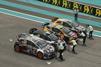 people riding on black and white sports car on road during daytime