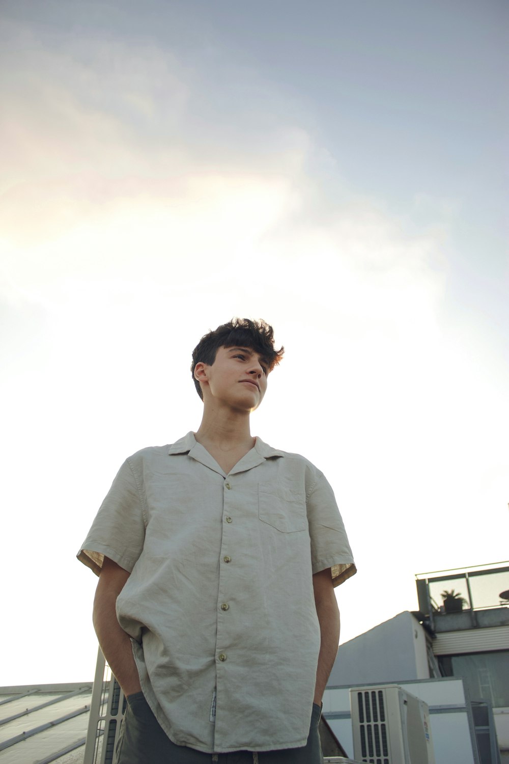 man in white button up shirt standing during daytime