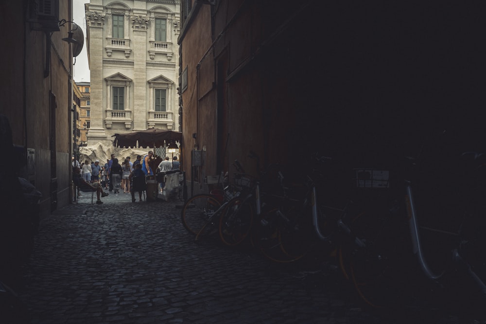 bicycles parked on sidewalk near building during daytime