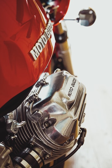 red and silver motorcycle engine
