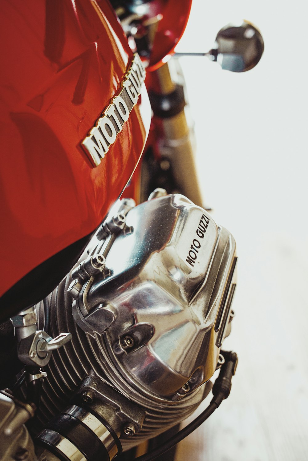 red and silver motorcycle engine