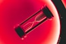 clear hour glass with red background