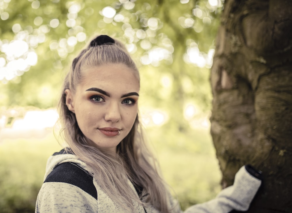 woman in gray and black sweater