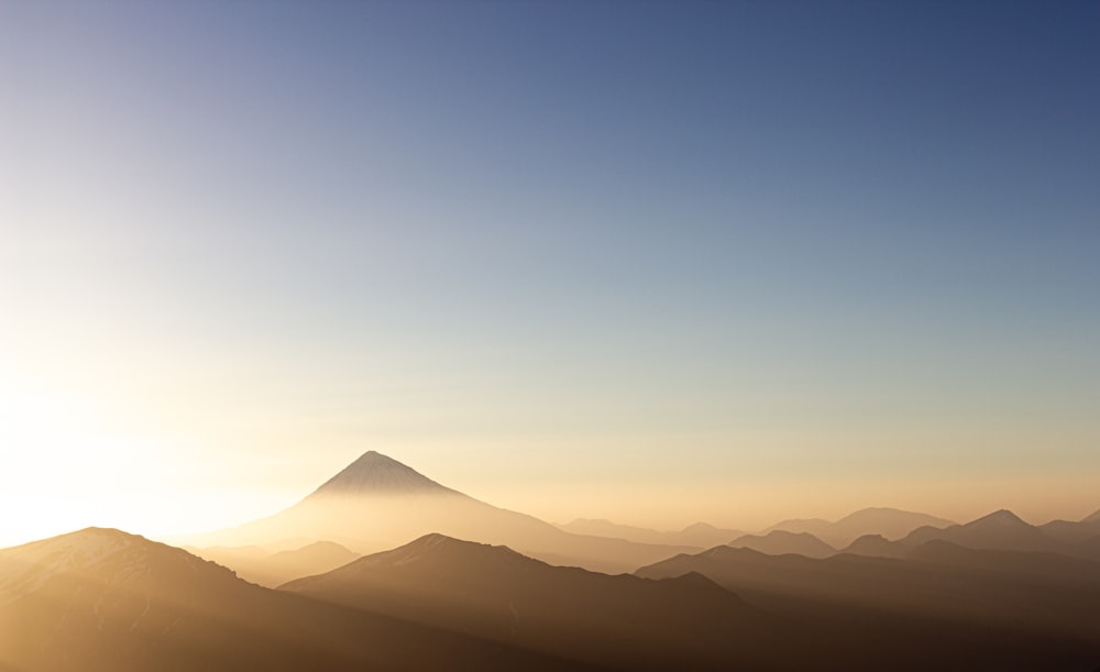 silhouette of mountain during sunset