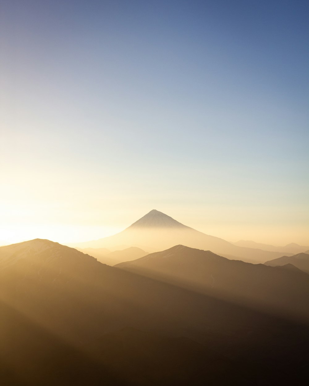 silhouette of mountain during sunset