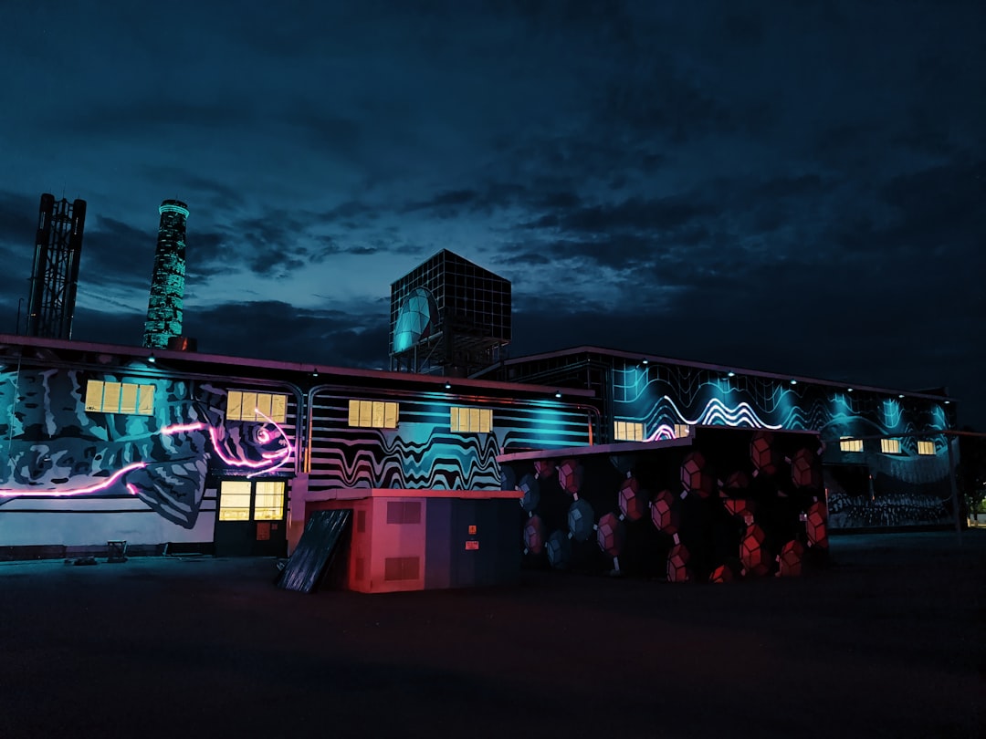 white and brown wooden house with lights turned on during night time