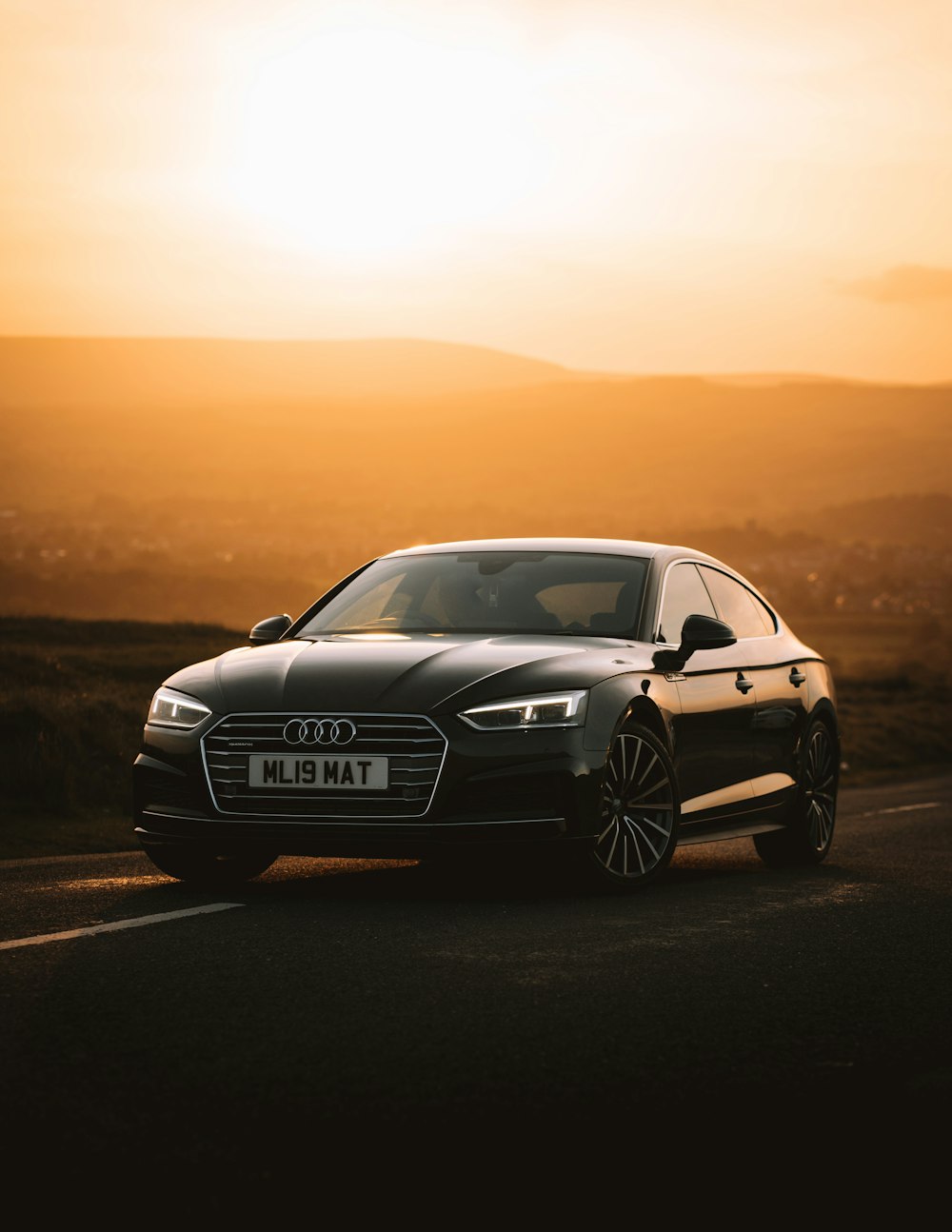 black mercedes benz coupe on road during sunset