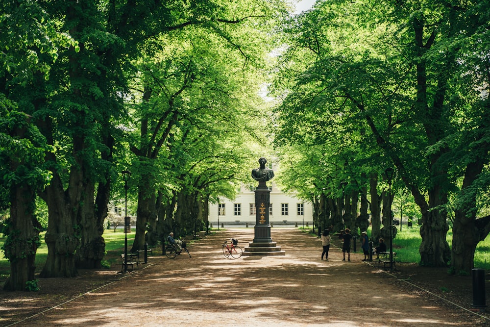 black statue in the middle of the forest