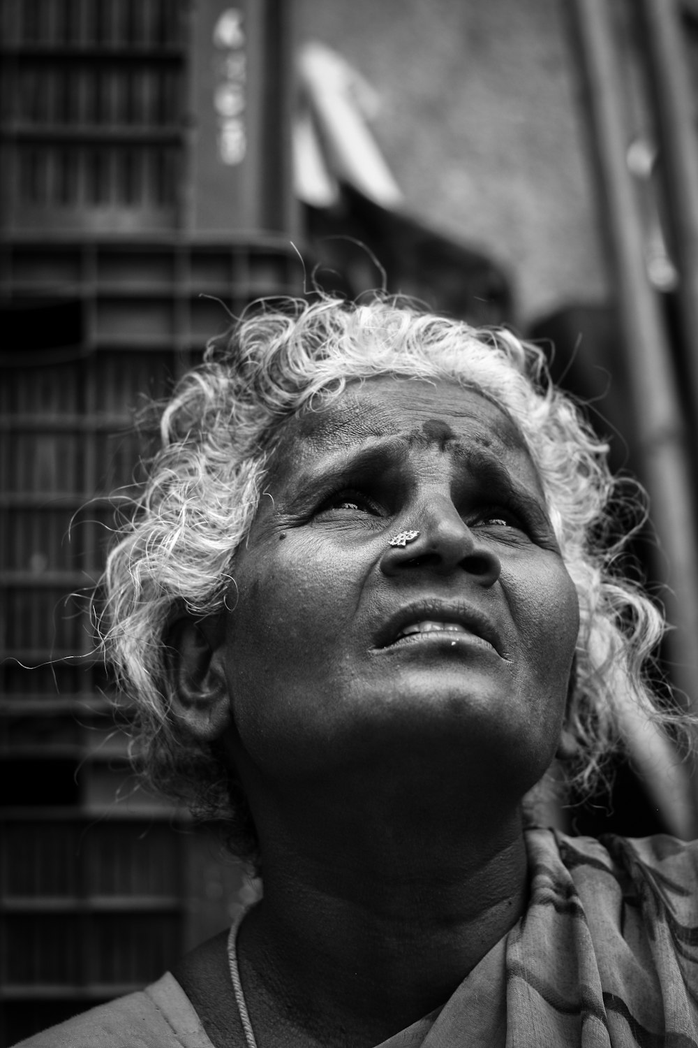 grayscale photo of man with curly hair