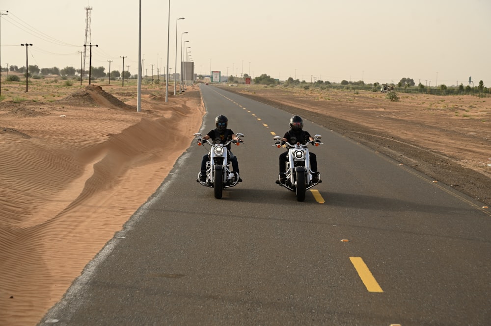 man in black motorcycle on road during daytime