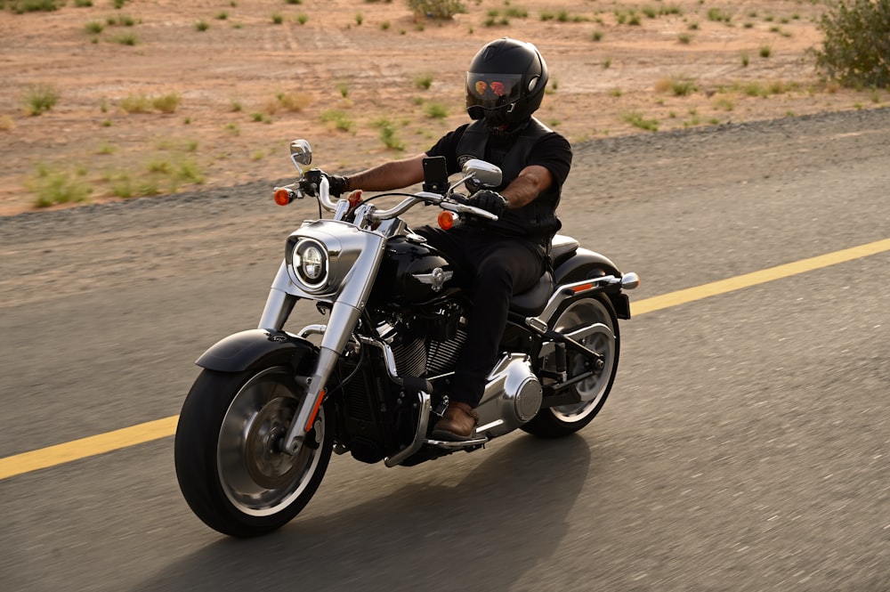 black and silver motorcycle on road during daytime