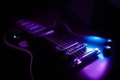 purple and black electric guitar
