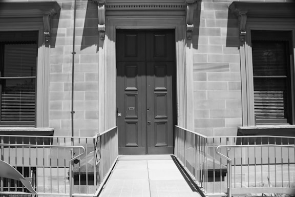Photo of the front entrance of Solid Door Solutions office building during daytime.